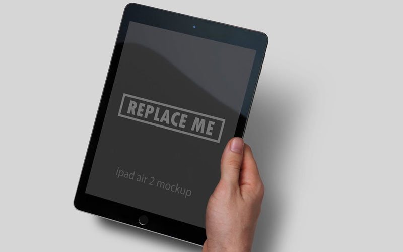 Free-Black-iPad-in-Hand-Mockup