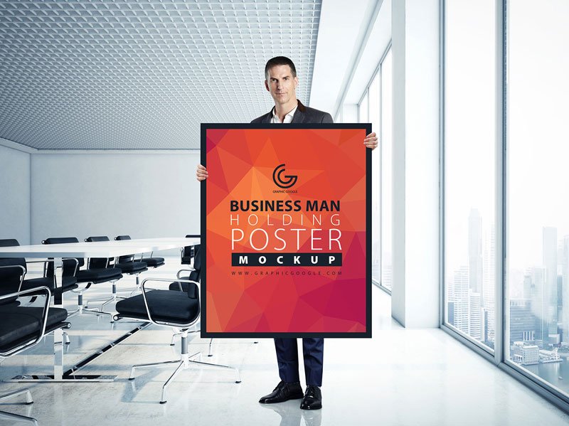 Business-Man-Holding-Poster-Mockup