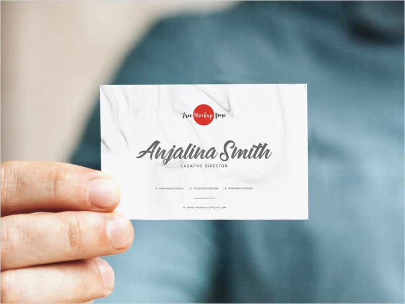 Free-Man-Holding-In-Hand-Business-Card-Mockup
