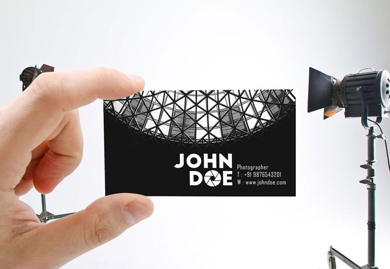 Male-Hand-holding-Business-Card-Mockup