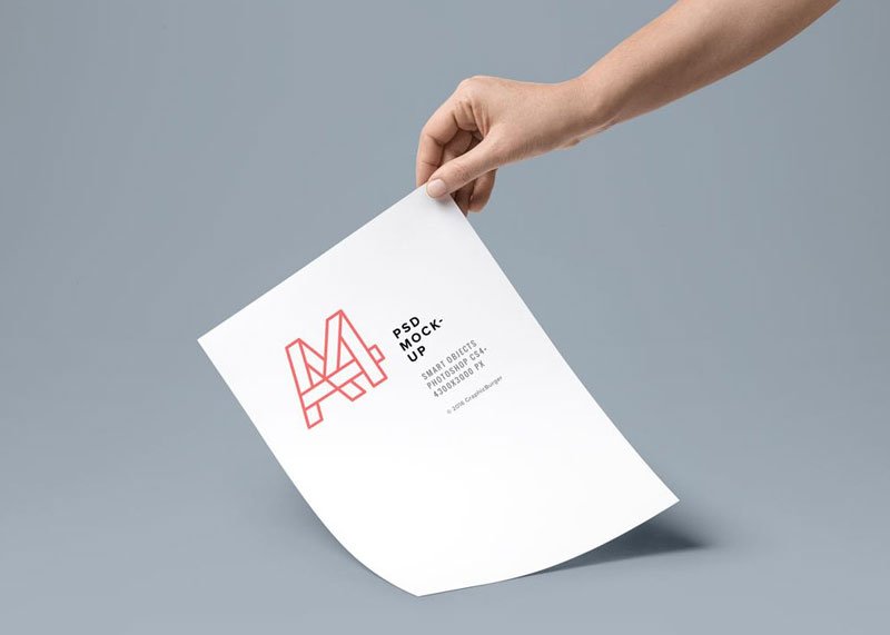 Hand-holding-A4-Paper-Mockup