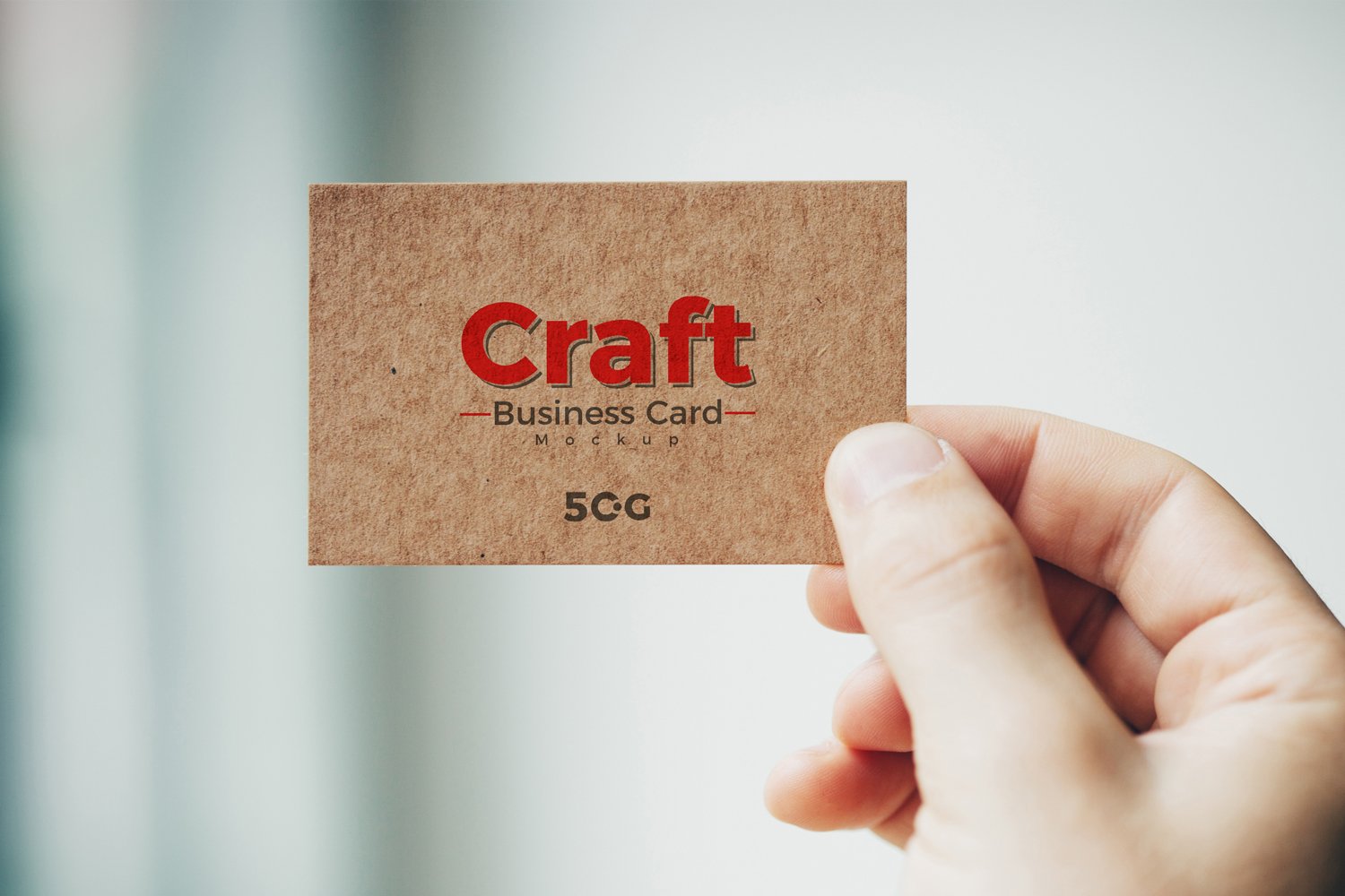 Free-Man-Holding-Craft-Business-Card-Mockup-PSD-2018