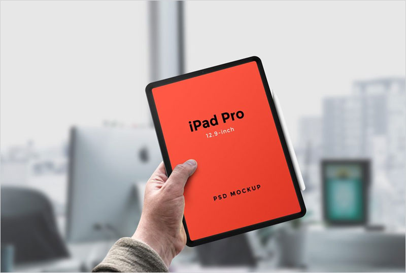 Hand-holding-iPad-Pro-Mockup