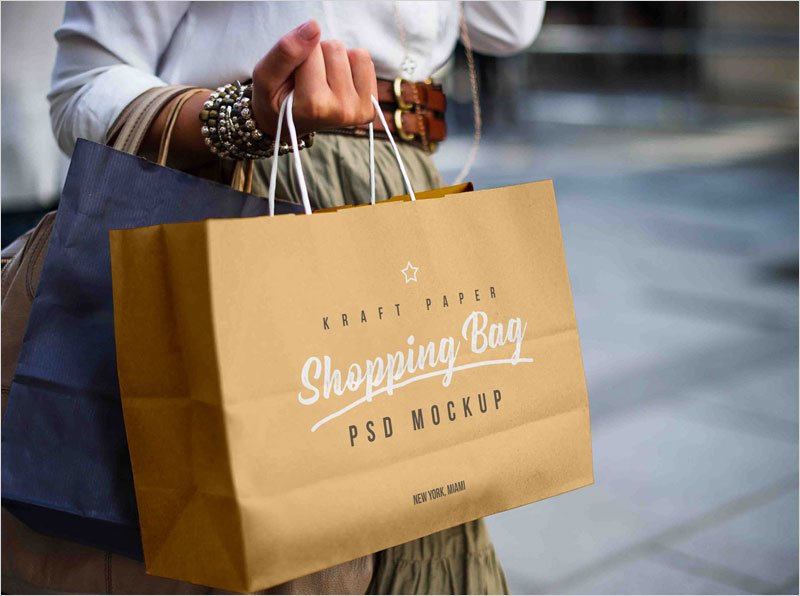 Free-Female-Holding-Shopping-Bag-Mockup-PSD